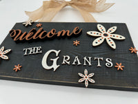 Rustic Wood Floral Family Name Sign in Orange and Black