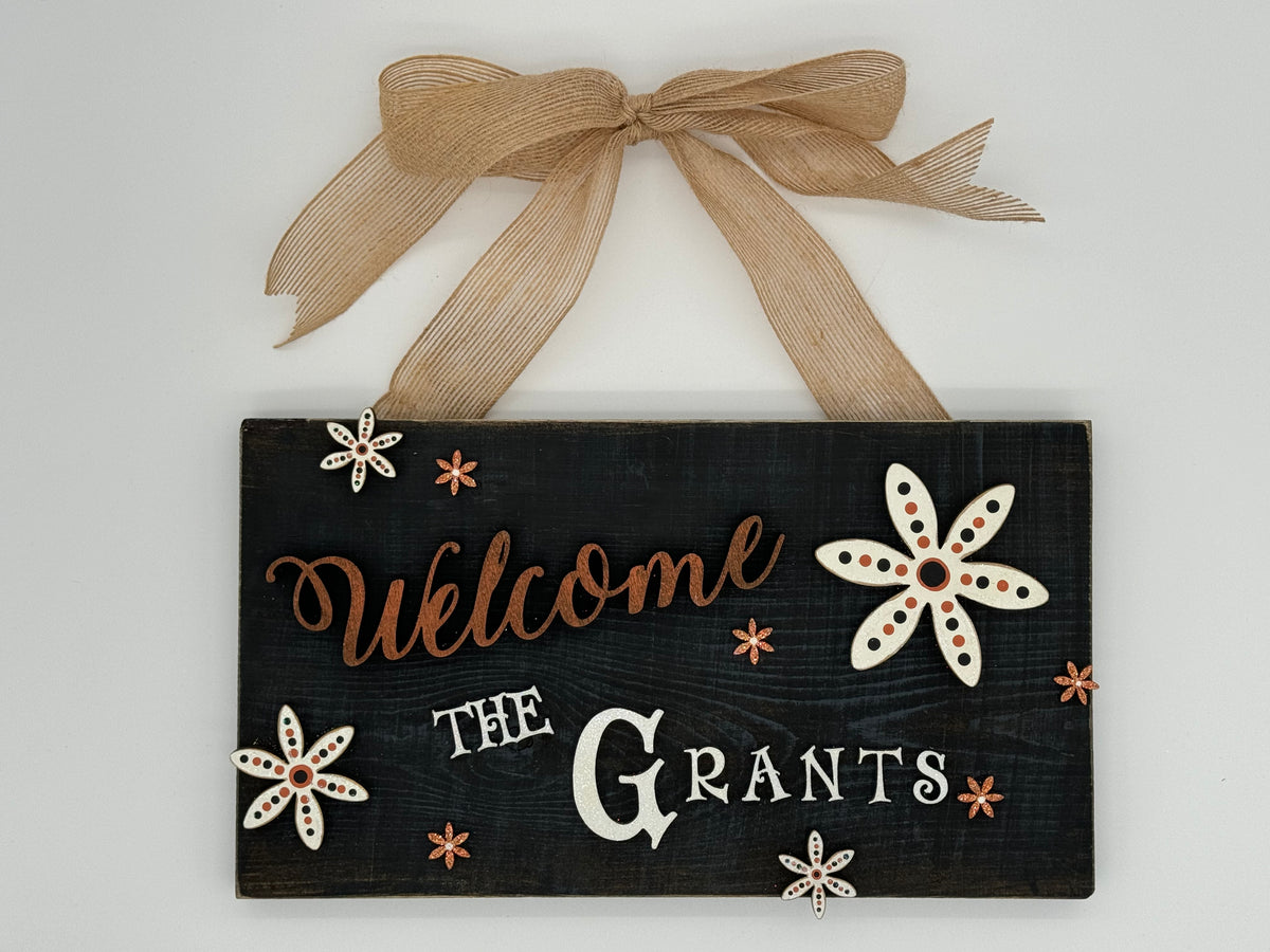 Rustic Wood Floral Family Name Sign in Orange and Black