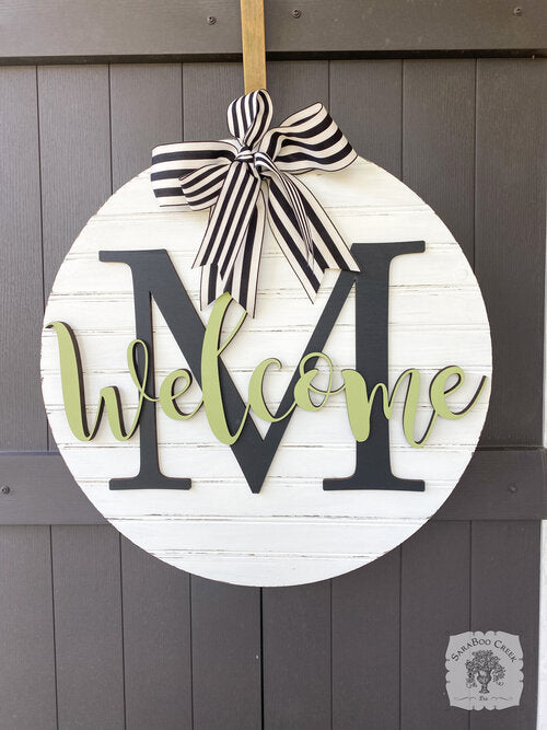 20" Round Sign Customized with Initial and Overlapping "Welcome"