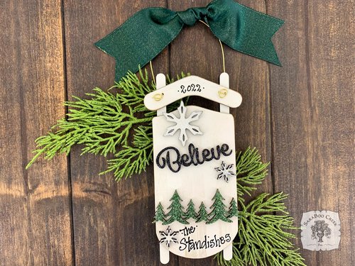 White Sled Christmas Ornament - Personalized Winter Scene with "Believe" & Pine Trees