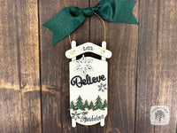 White Sled Christmas Ornament - Personalized Winter Scene with "Believe" & Pine Trees